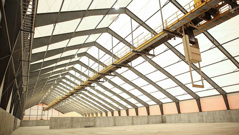 Frac sand facility constructed with rigid frame and tension fabric