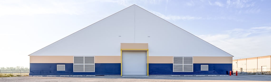 tension fabric building for cold steel storage located on a port