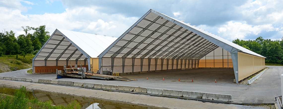 two tension fabric structures for salt storage