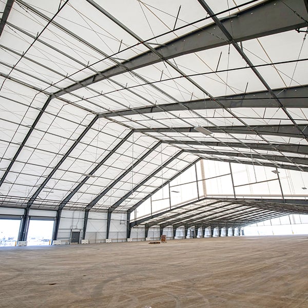 Legacy building with steel framed fabric aviation hangar