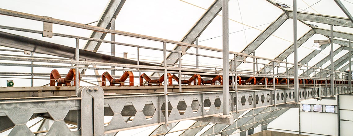 conveyor inside tension fabric fertilizer storage building