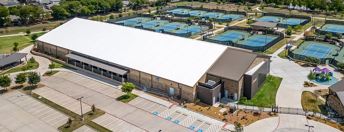 Courts of McKinney exterior photo showing roof panels