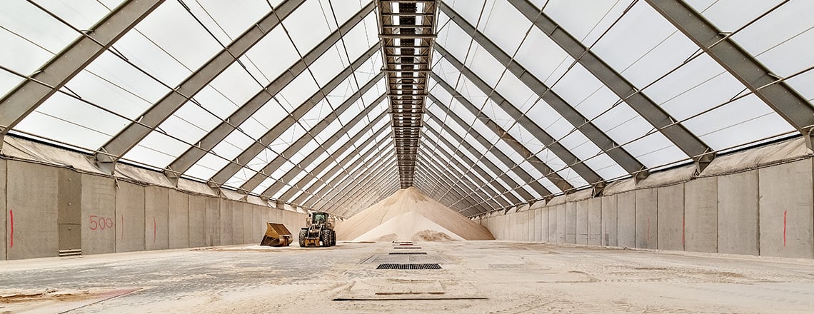 large fabric building interior with conveyor