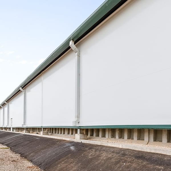 sidewall of tension fabric building with precast walls